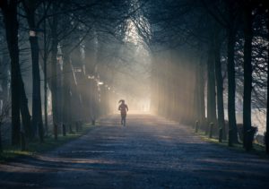 Woman Running On Road