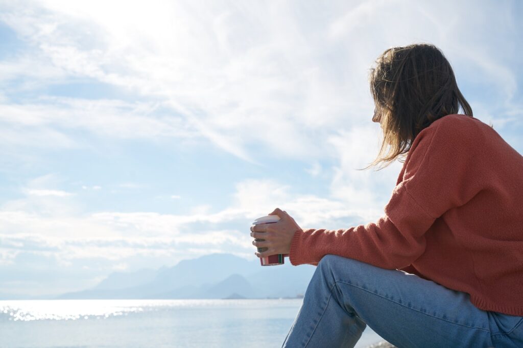 Woman alone drinking coffee