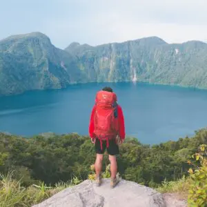 Red Backpacker on a Lake