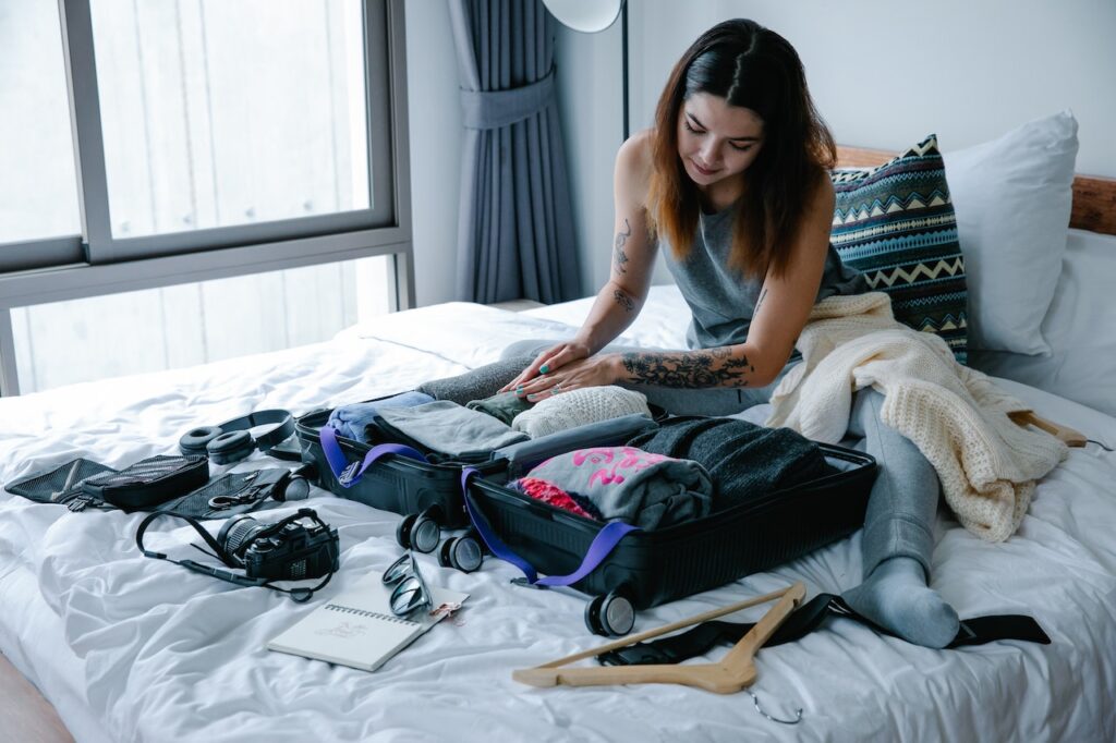 Woman packing on the bed