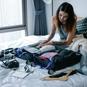 Woman packing on the bed
