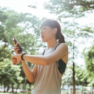Asian woman checking her heart rate during exercise