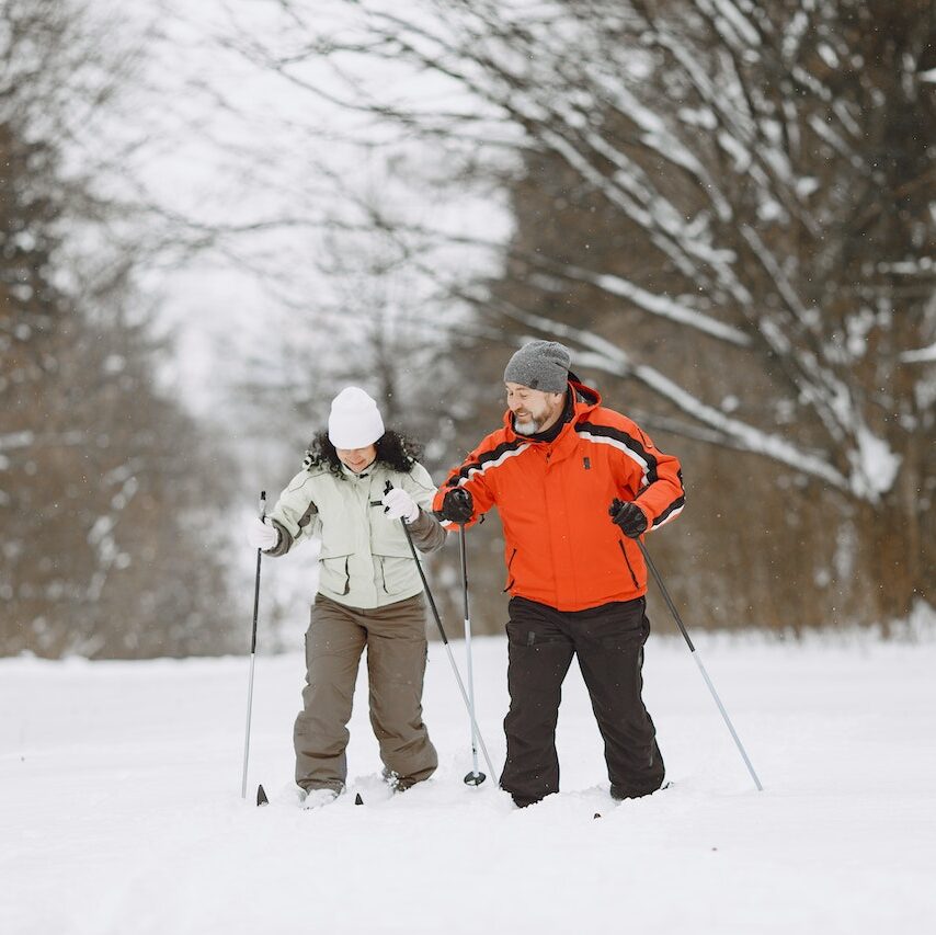 Couple Skiing on Snow