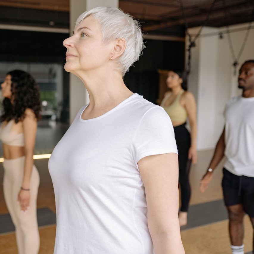 Different age and fit level people in a workout class