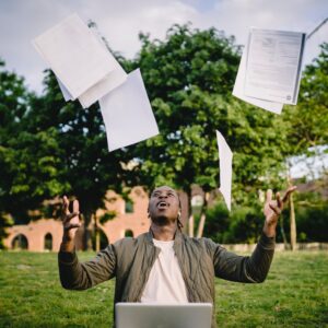 Man throwing papers in the air