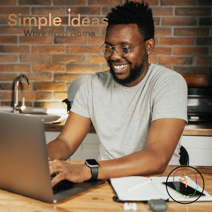 Black Man Happy Working on a Laptop From Home