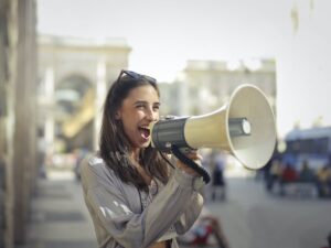 Woman screaming with a megaphone