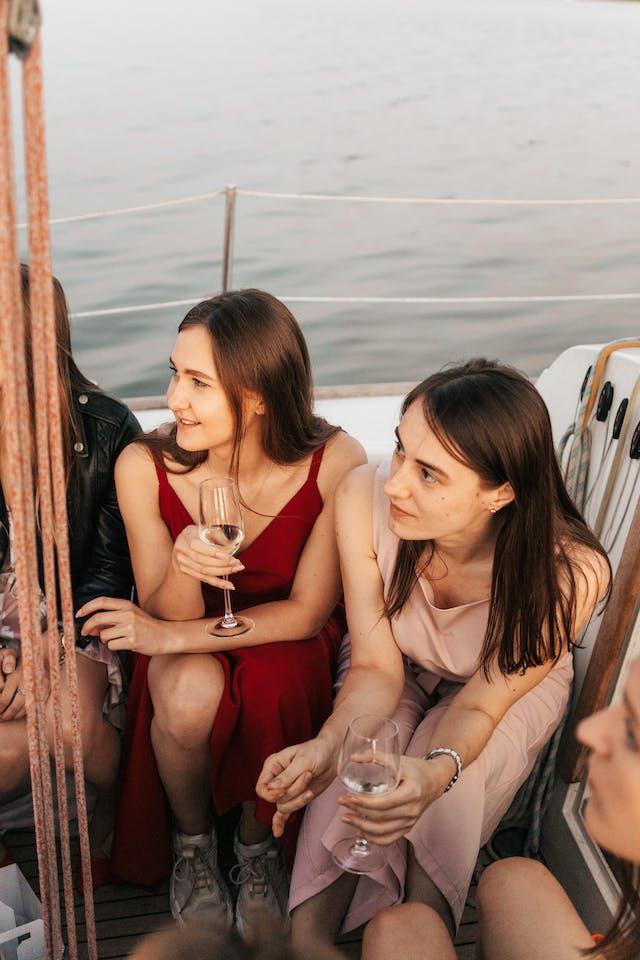 Friends drinking wine on a boat
